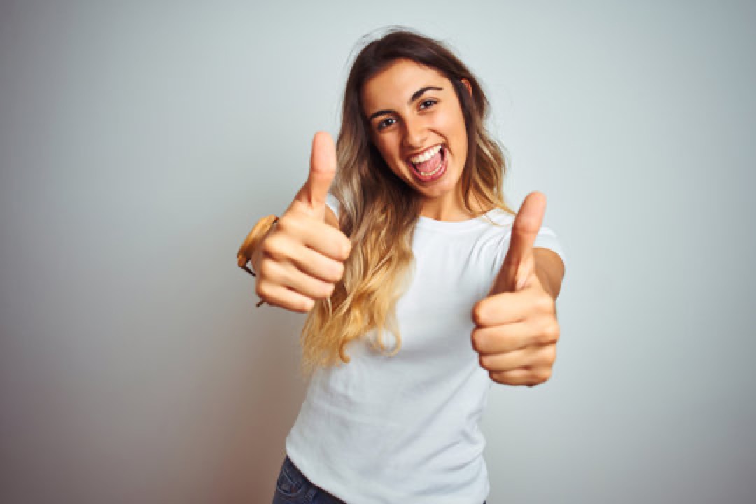 Happy customer giving two thumbs up
